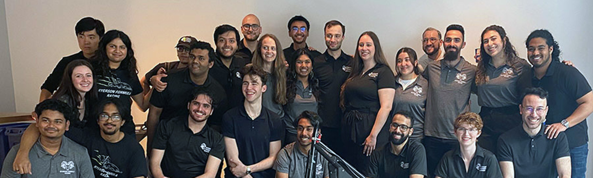 TMU's Formula Racing team poses for a group shot