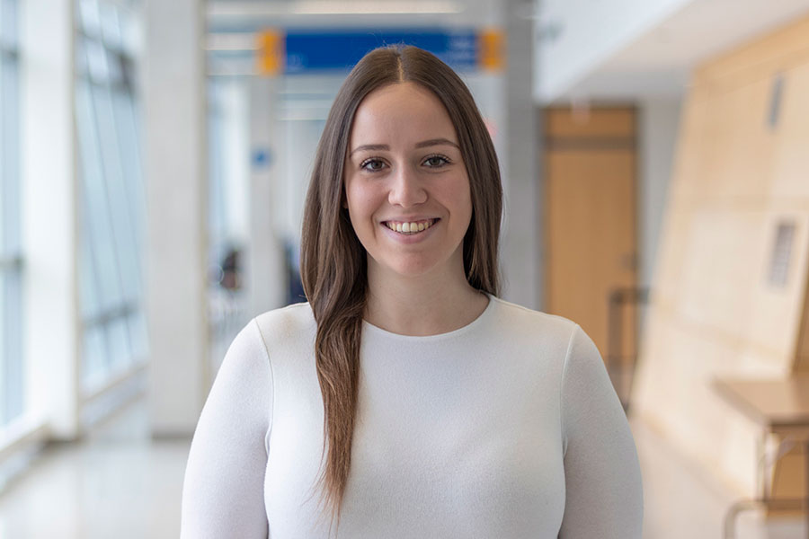 Erica Attard smiling in a TMU hallway