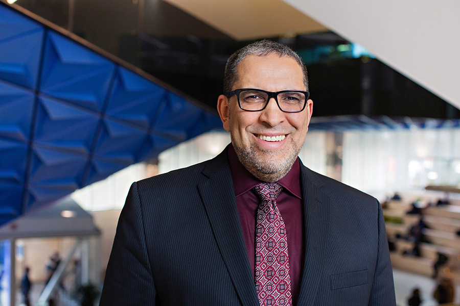 Dr. Mohamed Lachemi smiles outside a Toronto Metropolitan University building