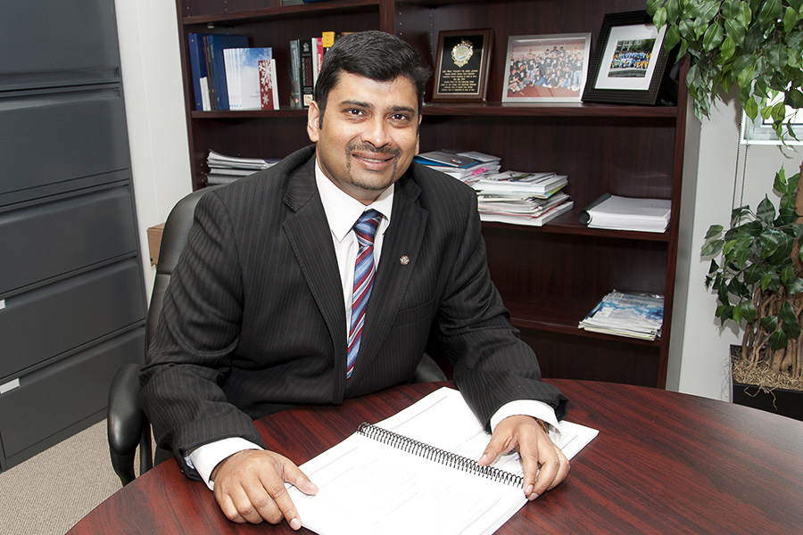 Dr. Sri Krishnan sits at his desk