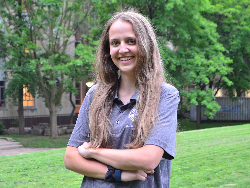 Claudia Bialkowski, a third-year biomedical student, poses for her Formula Racing team picture