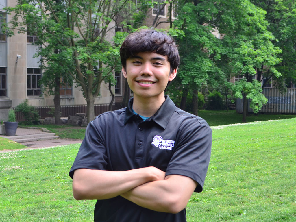 Dion Matias, an electrical engineering undergrad, poses for his Formula Racing team picture