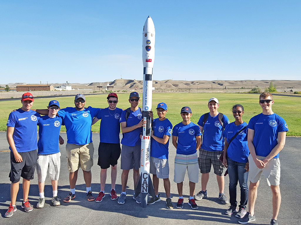 Michael Melville (fourth from the left) stands with his Ryerson Rocketry Club teammates