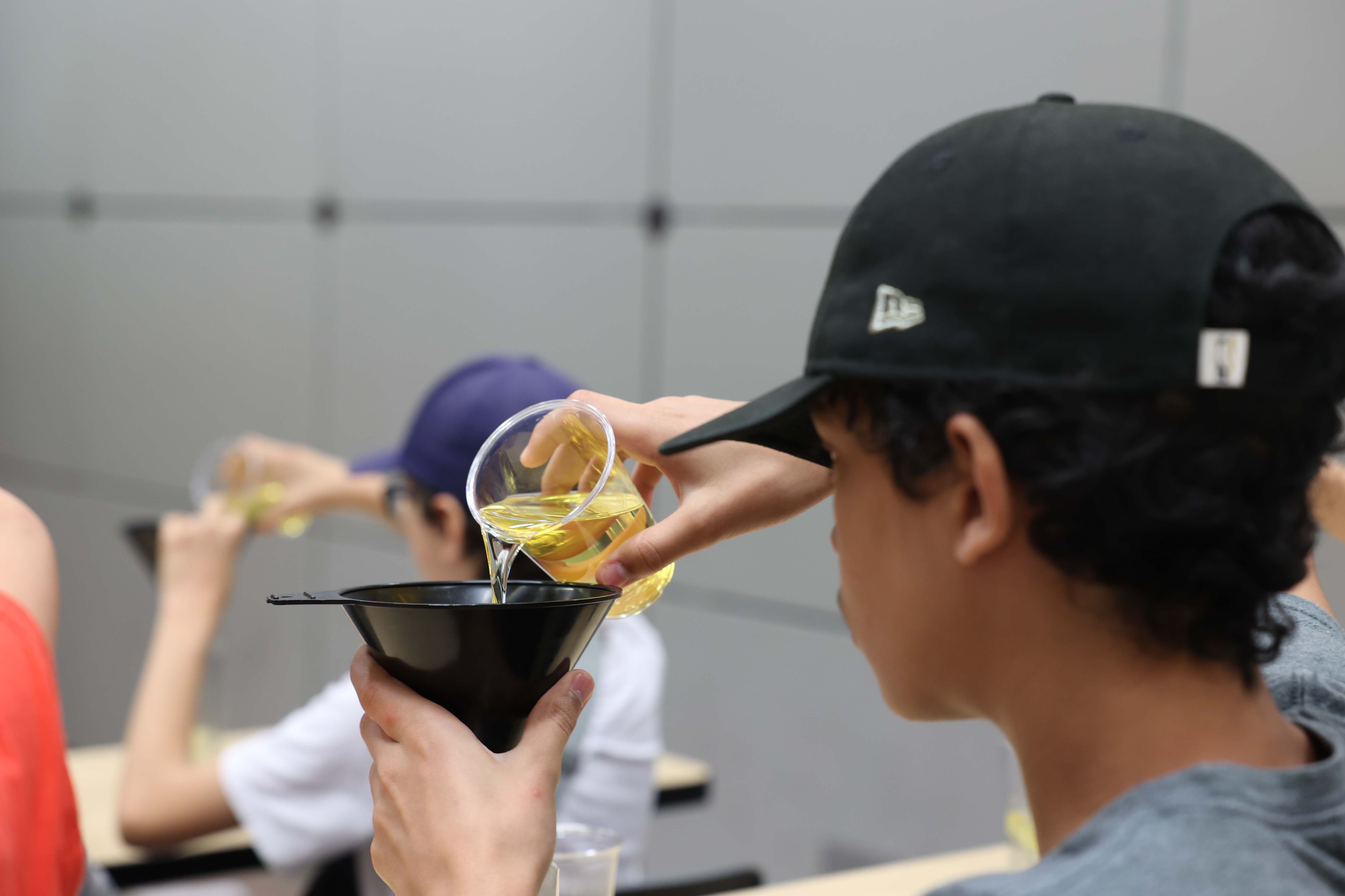 feas outreeach showing kid experimented with liquid