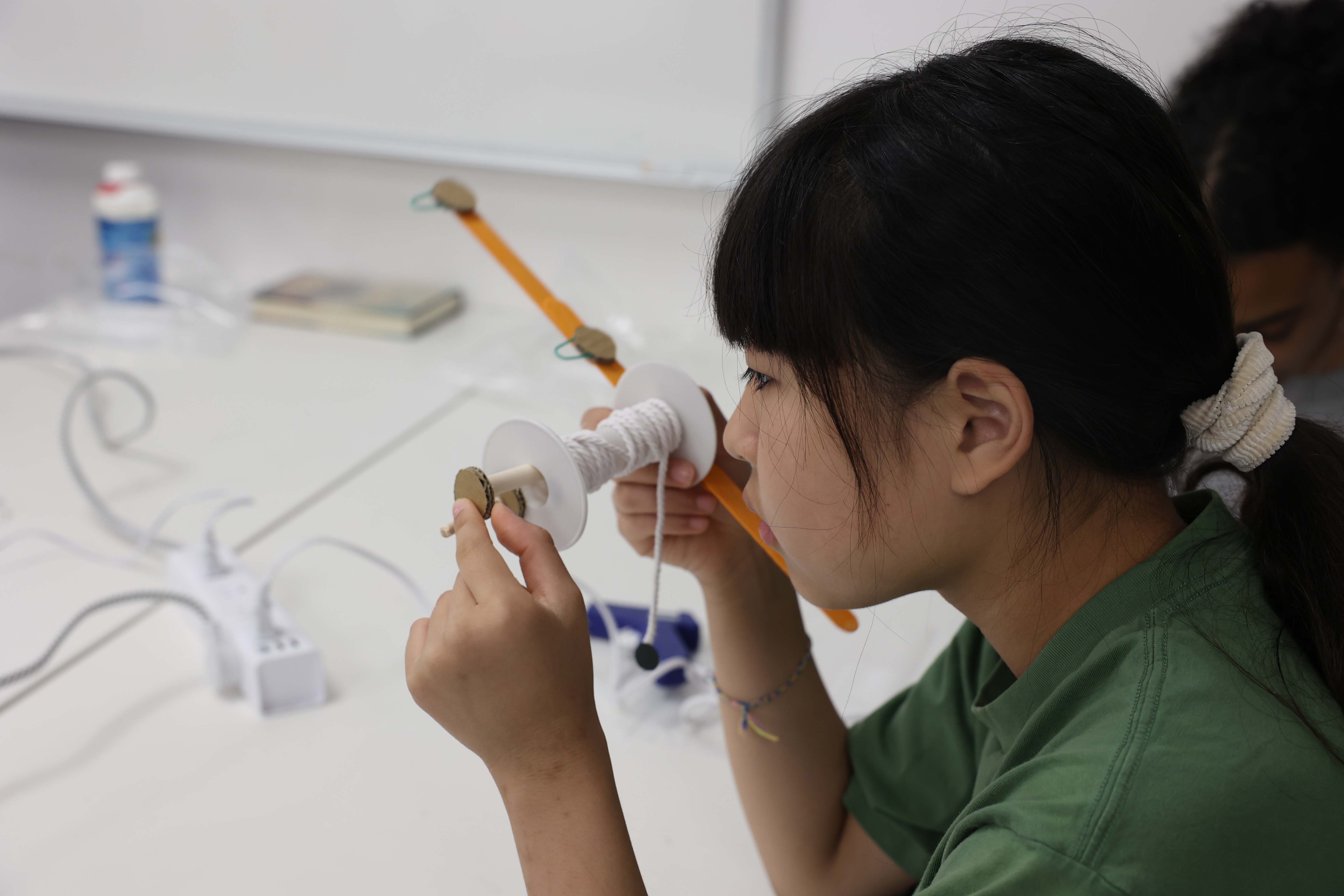 feas outreeach showing kid experimented with object