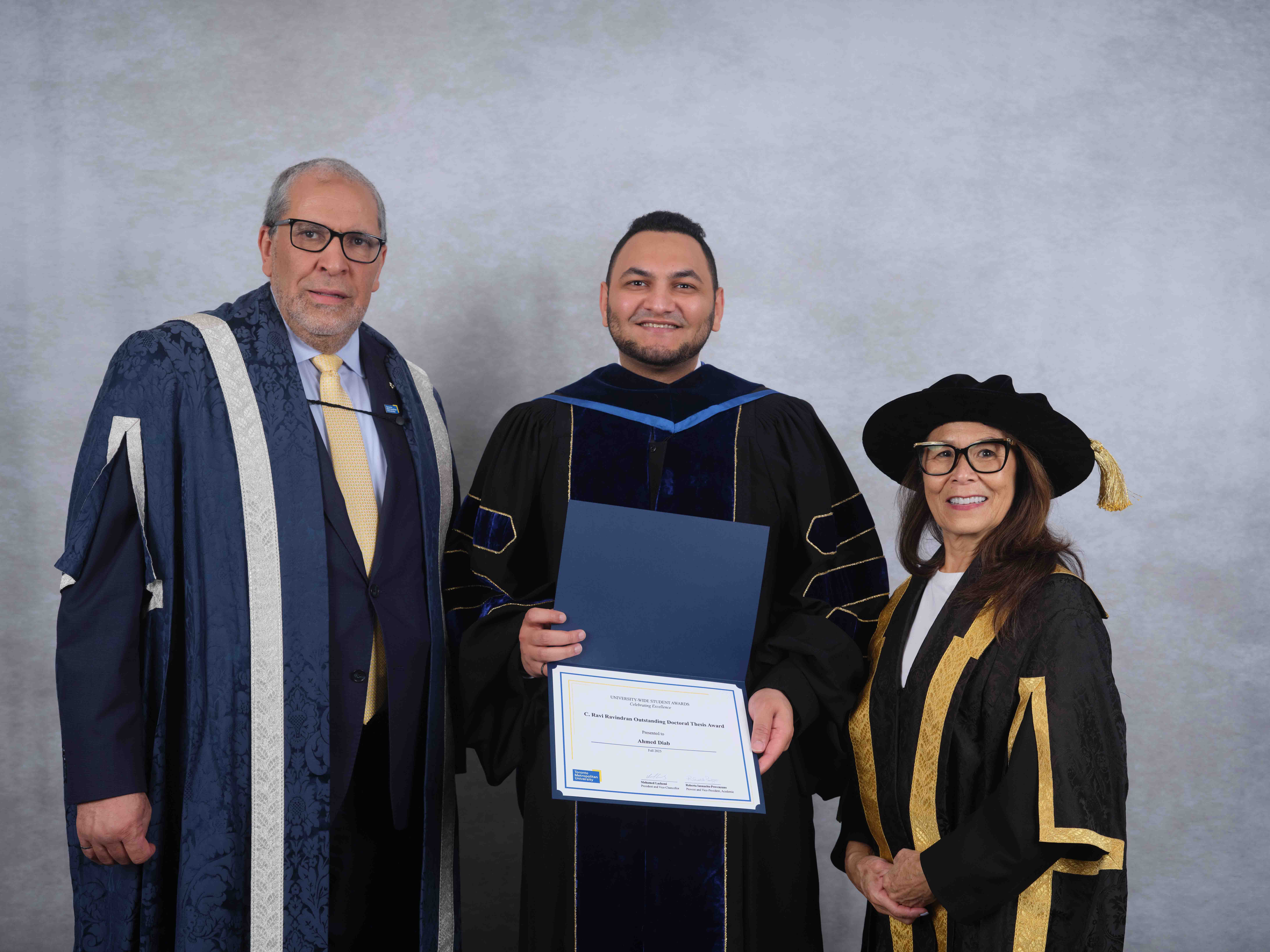 Diab receiving the Dr. C. Ravi and Shanti Ravindran Award from the president and vice-chancellor of Toronto Metropolitan University, Dr. Mohamed Lachemi, and chancellor Donette Chin-Loy Chang.