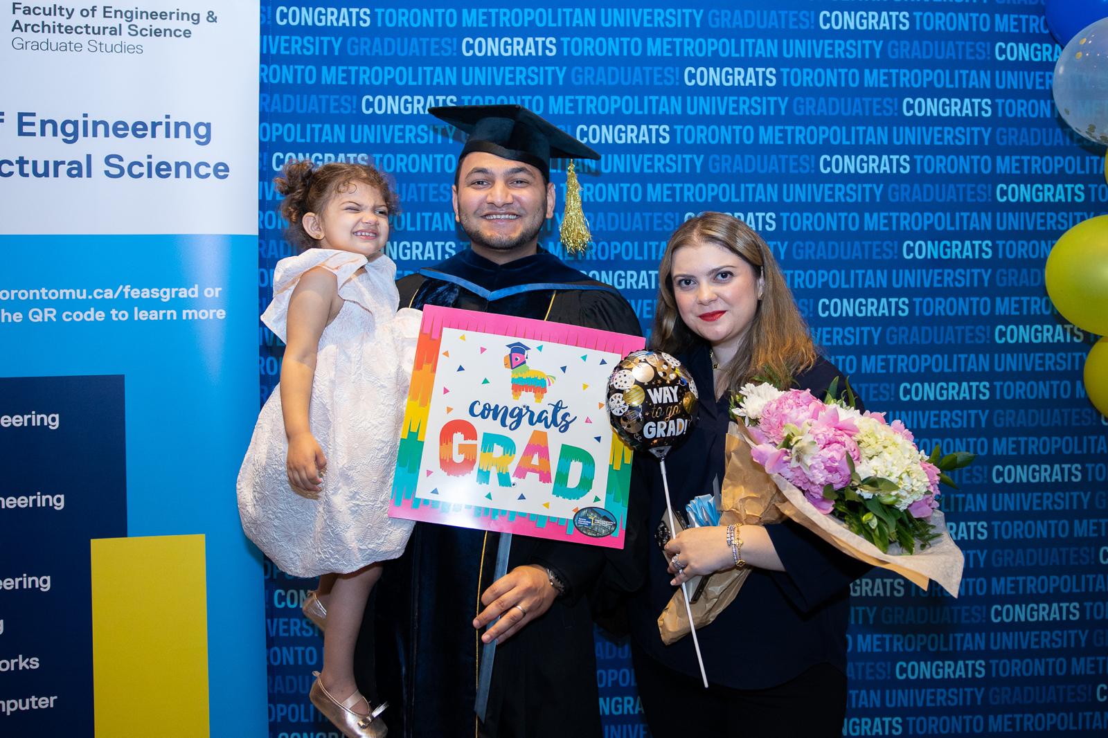 Diab celebrating with his family at convocation. 