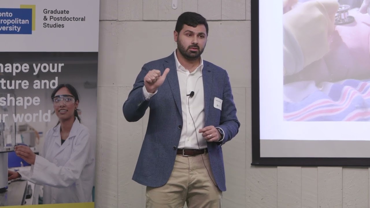 Abdou “The First Minute of Life” project at TMU’s 3-Minute Thesis competition in 2025.