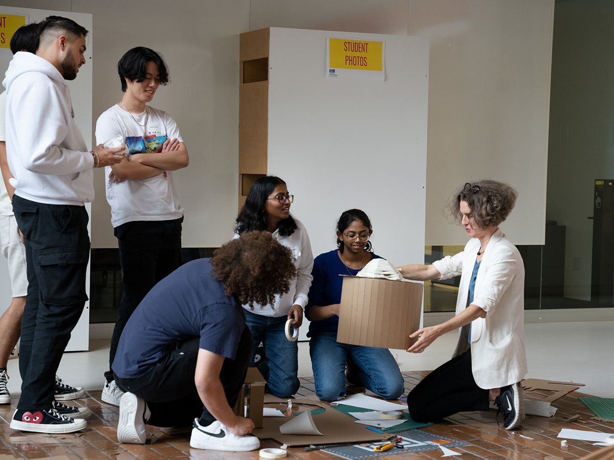 Lisa Landrum completing an activity with first-year students at orientation. 