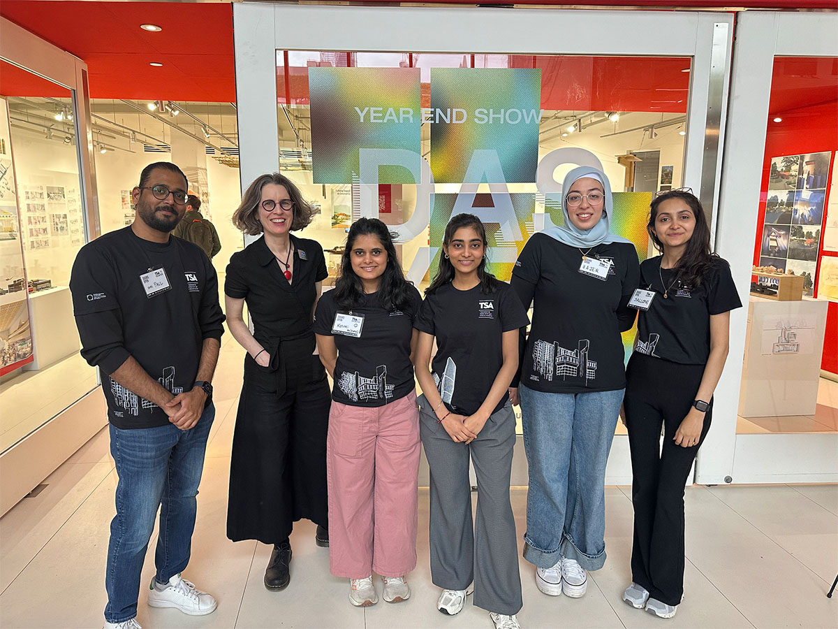 Lisa Landrum standing with student volunteers at Doors Open at Toronto Metropolitan University. 