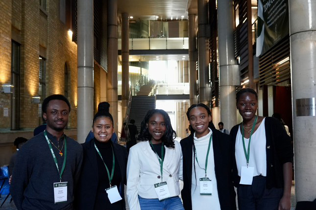 Group of smiling students from the National Society of Black Engineers attending a conference.
