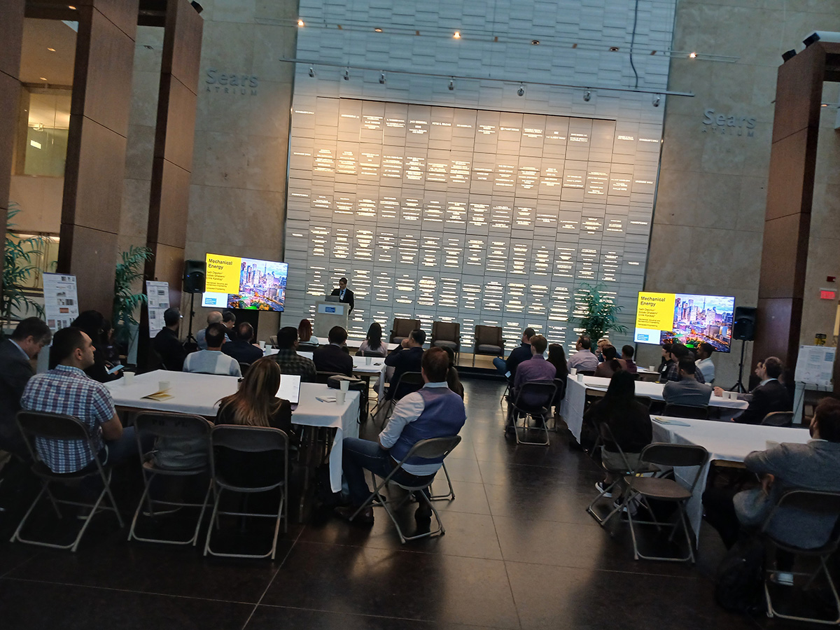Seth Dworkin presenting to a group of people in an auditorium.
