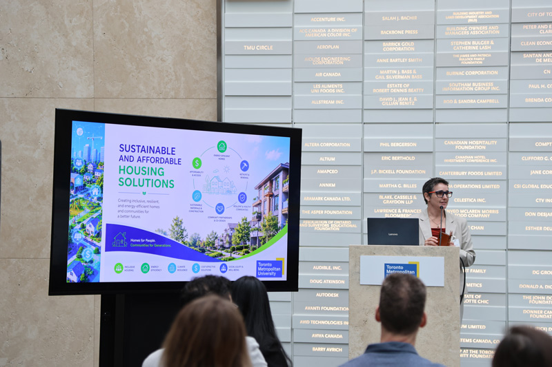 Professor Jenn McArthur presenting her research on sustainable housing at Toronto Metropolitan University. 