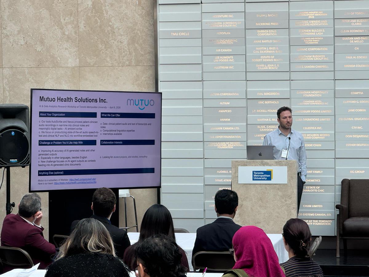 Noah Crampton presenting to workshop audience.