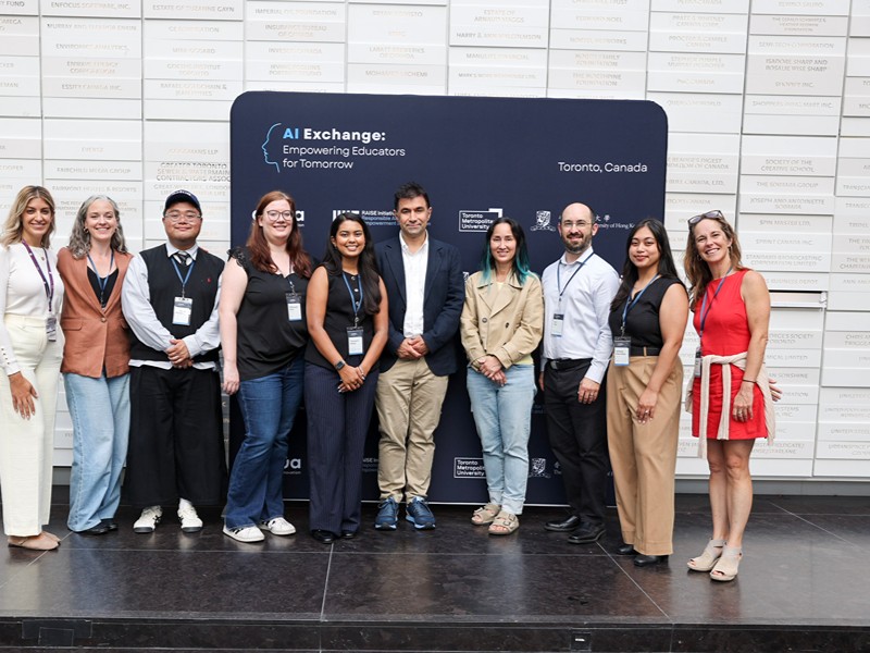 Actua, MIT RAISE, and TMU staff pose together in front of an "AI Exchange" backdrop.