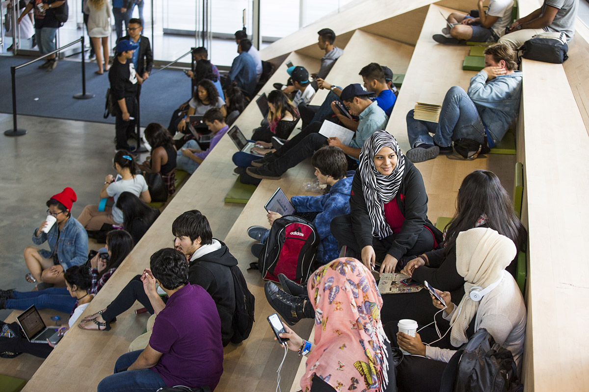 Group of students chatting and studying at the Student Learning Centre