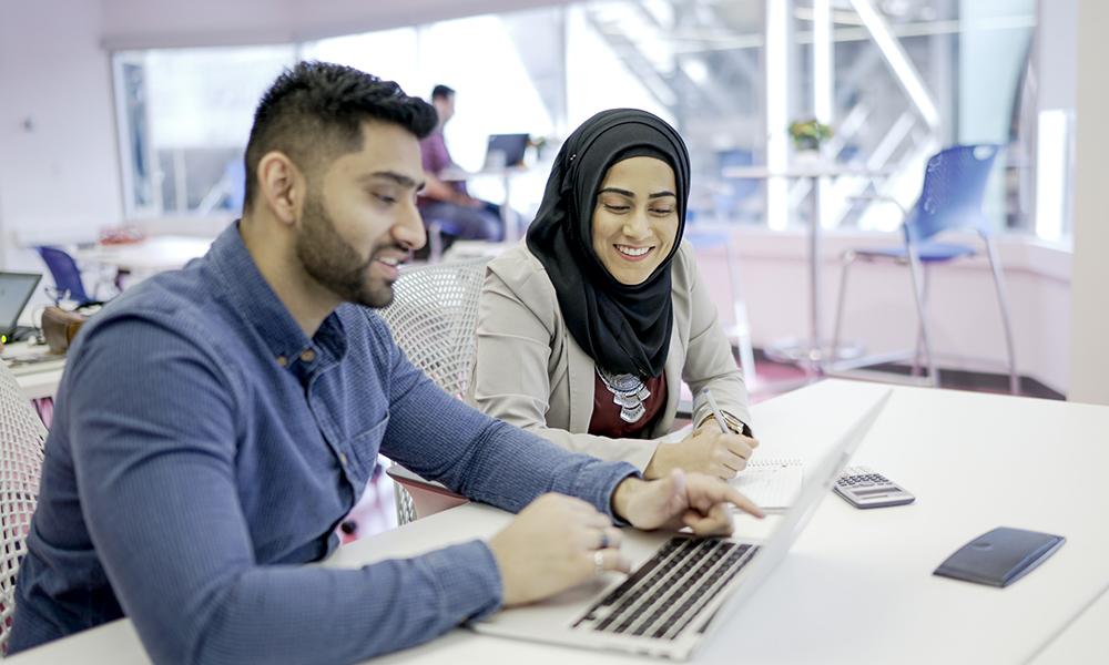 Two students looking at award options