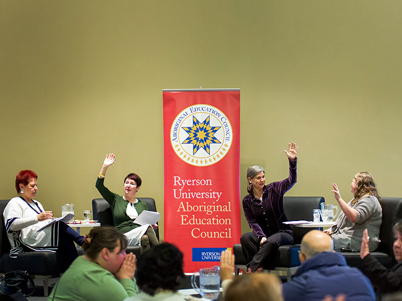 Four panellists at a Dine and Discourse event on Truth and Reconciliation at TMU