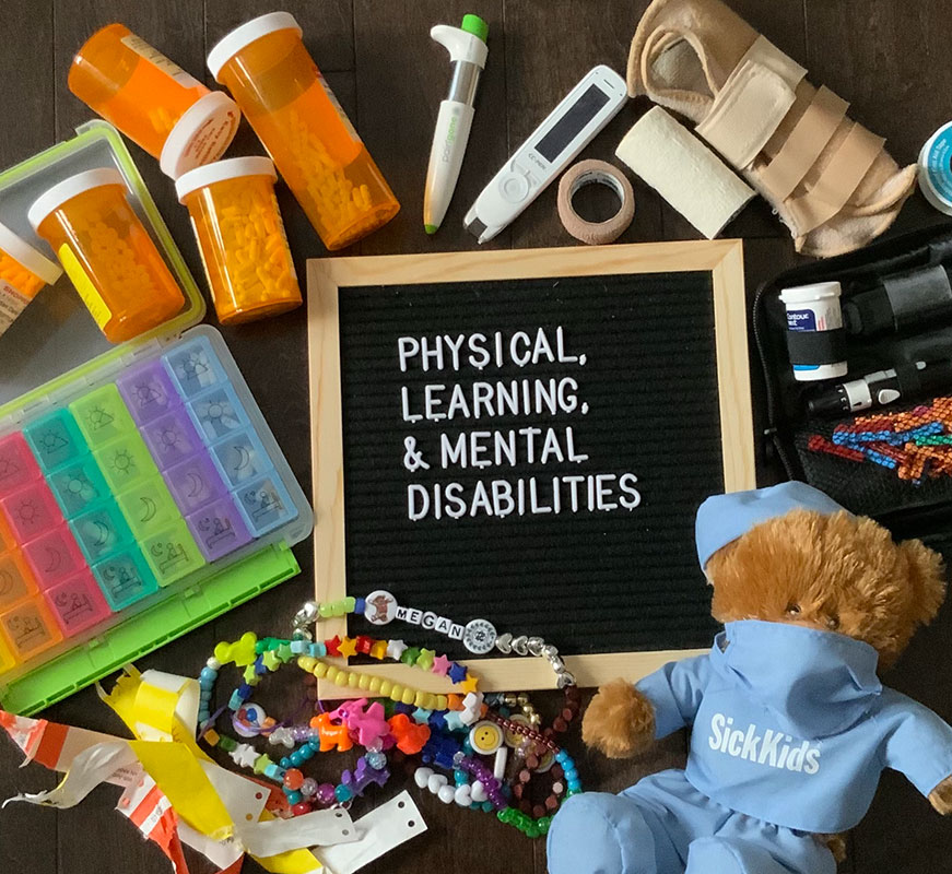 words in capital letters: PHYSICAL, LEARNING, & MENTAL DISABILITIES in white lettering on a black background in a wooden frame.