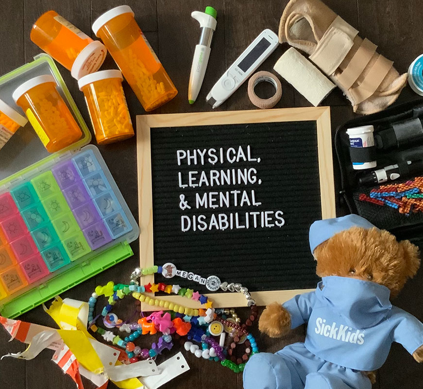 words in capital letters: PHYSICAL, LEARNING, & MENTAL DISABILITIES in white lettering on a black background in a wooden frame. 