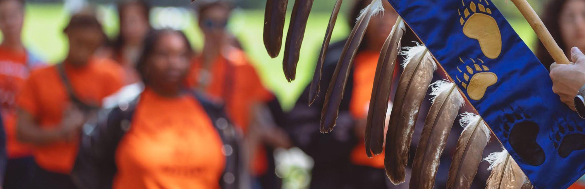 people wearing orange shirts to commemorate orange shirt day