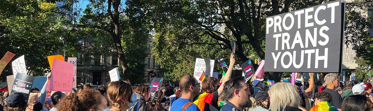 A group of people protesting for Trans youth rights