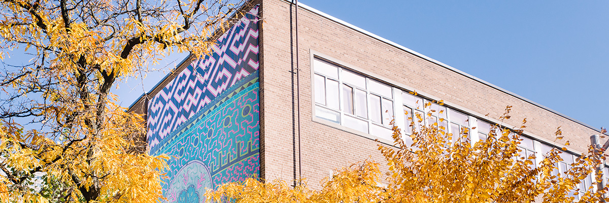 Located on the west-facing wall of Kerr Hall West at Gould St. and Nelson Mandela Walk