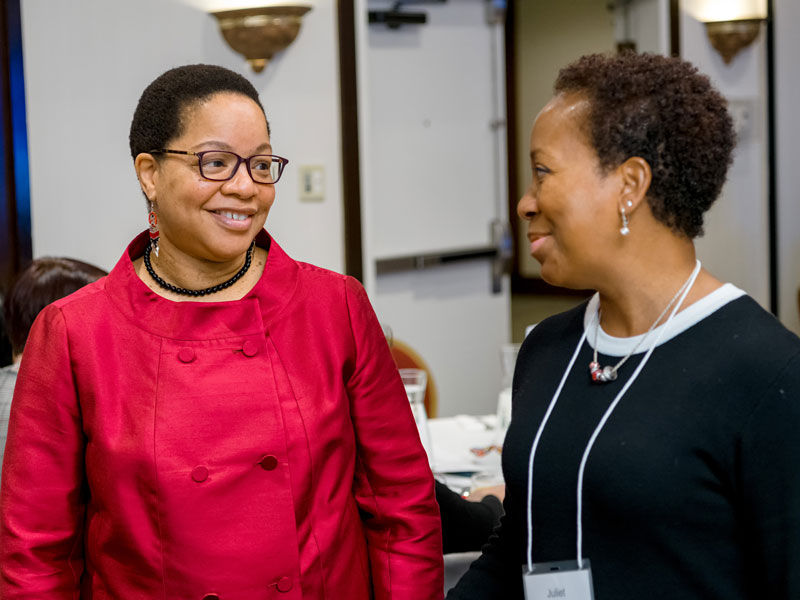 Denise O'Neil Green speaking to a colleague