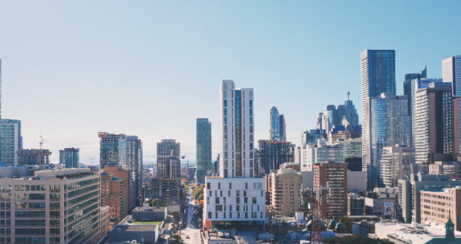 Elevated view of the TMU Daphne Cockwell Health Sciences Complex and student residence tower in downtown Toronto.