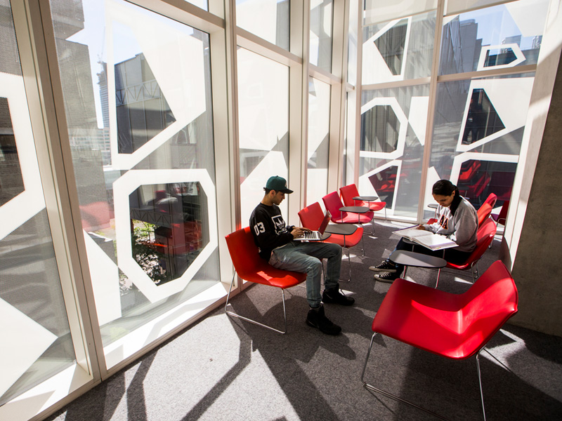 Student enjoying a sunny nook in the Student Learning Centre.