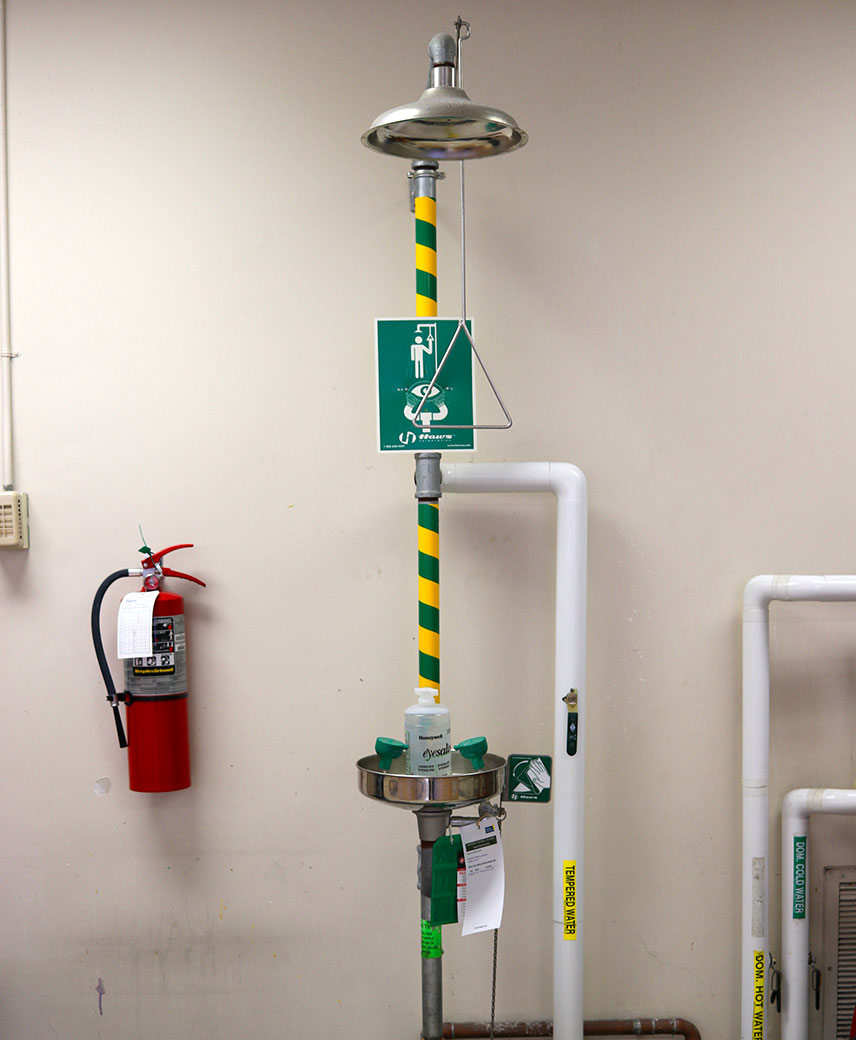 Emergency eyewash station, safety shower and fire extinguisher. 