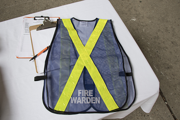 Fire warden vest, blue with a yellow cross on the back