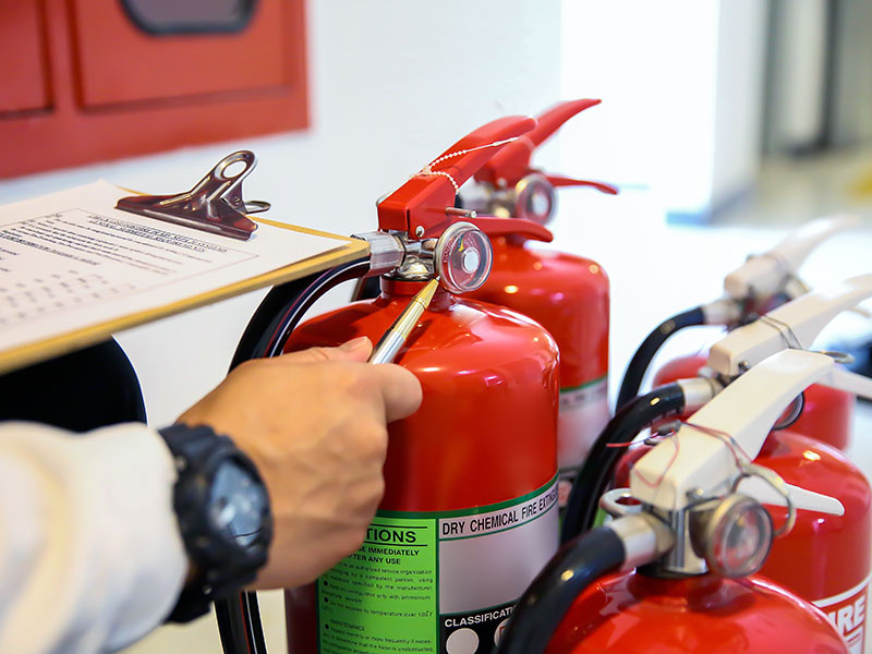 Engineer now inspection services red fire extinguishers tank concepts of fire station for emergency prevention rescue and fire safety training.