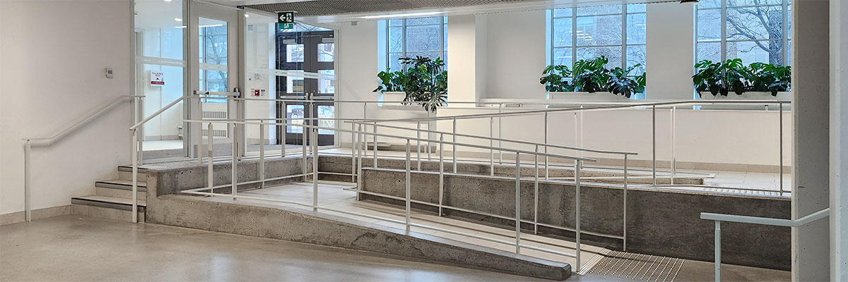 Interior accessibility ramp at CUI improves access where floors are of offset from the entrances.