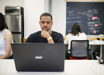 A person in front of his laptop