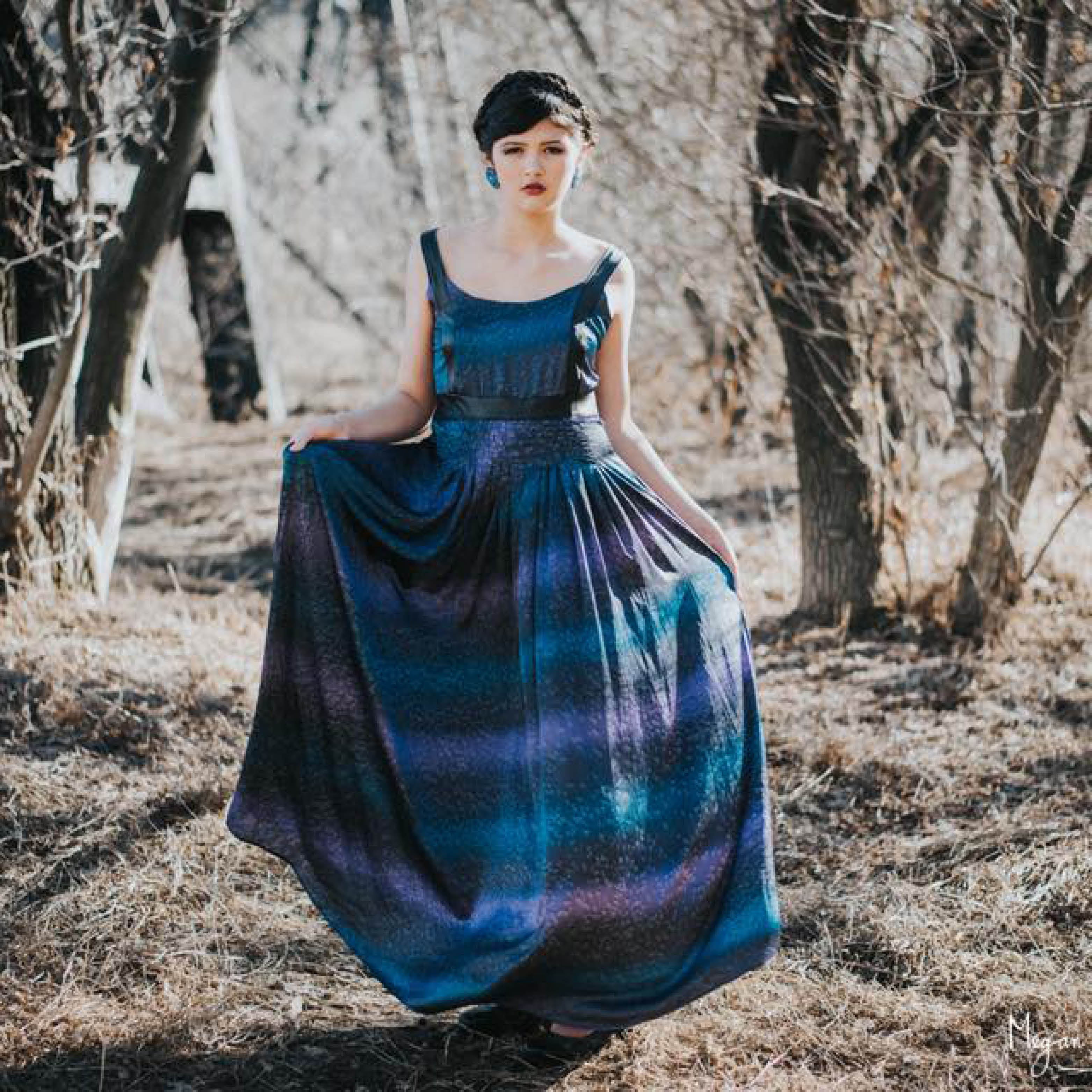 Heather Bouchier Designs blue dress in the woods.