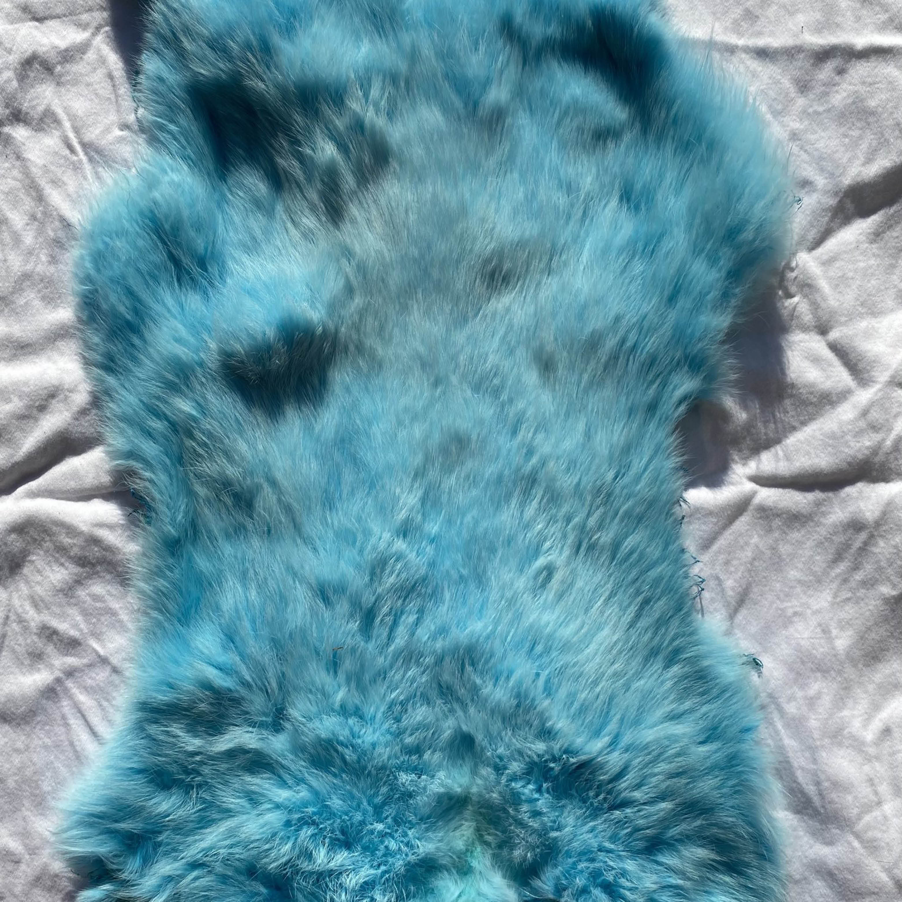 Nanaboozho’s Beads blue rabbit fur.