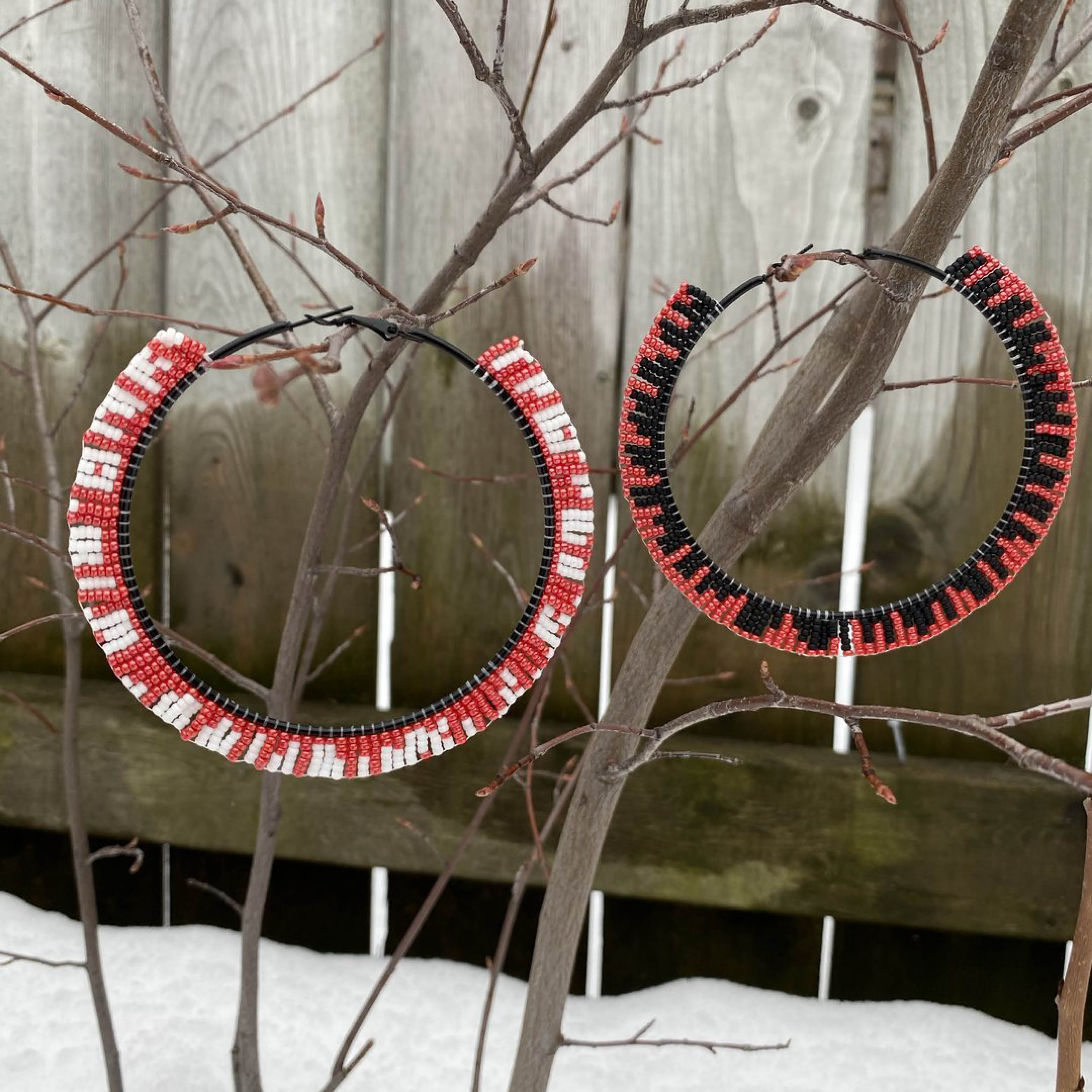 Nanaboozho’s Beads red, white and black hoop earrings.