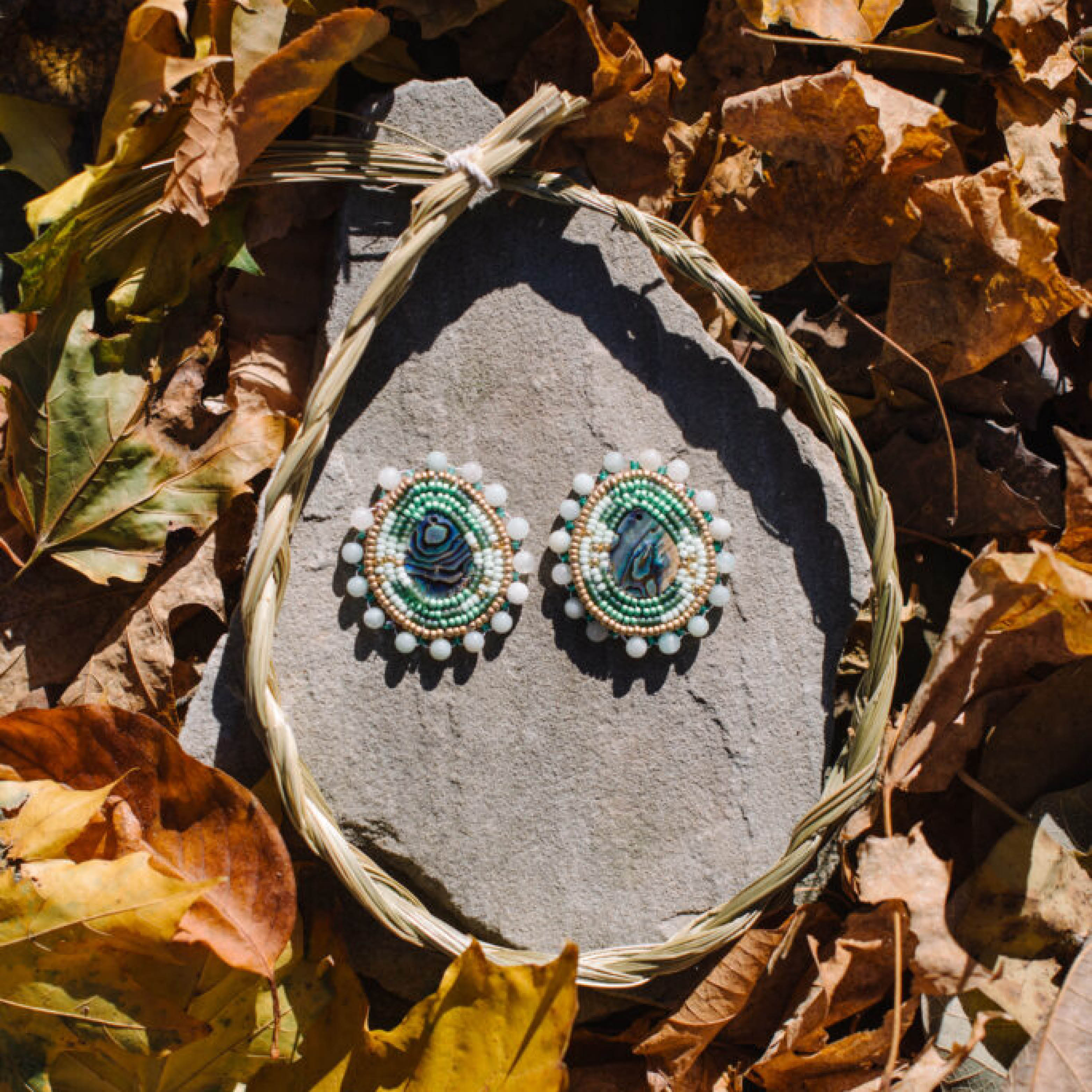 Raónraon Creations green and white beaded earrings.