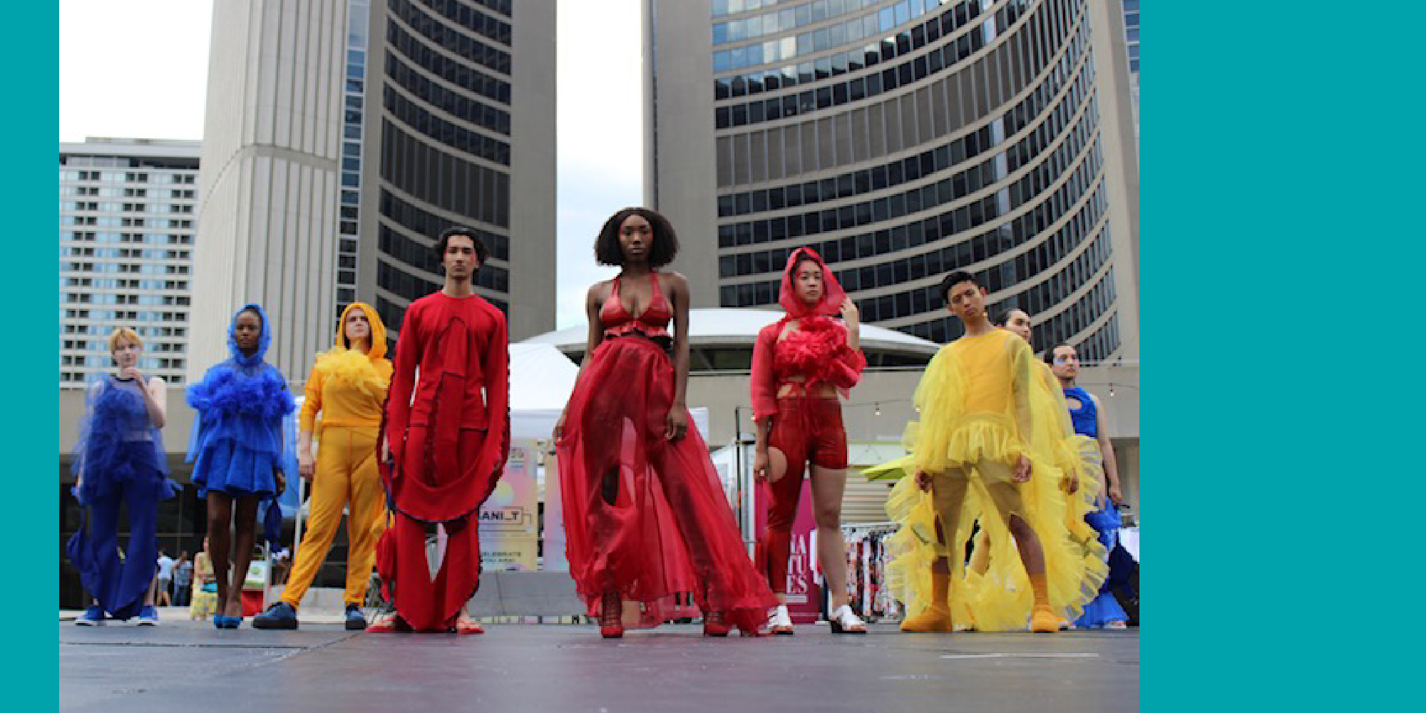 Models wearing non-binary collection by Charlotte Carbone with red, blue, yellow colours at URBANI_T, a large-scale free outdoor celebration of creativity and local talent
