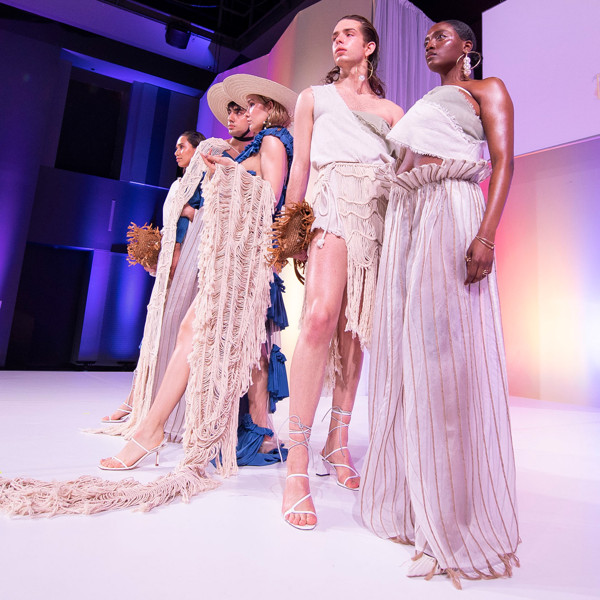 Models posed on runway during student fashion show