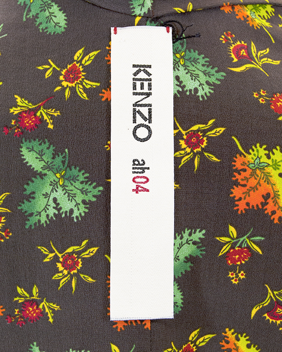 The label of a kimono style jacket with decorative necktie which reads "Kenzo ah04"