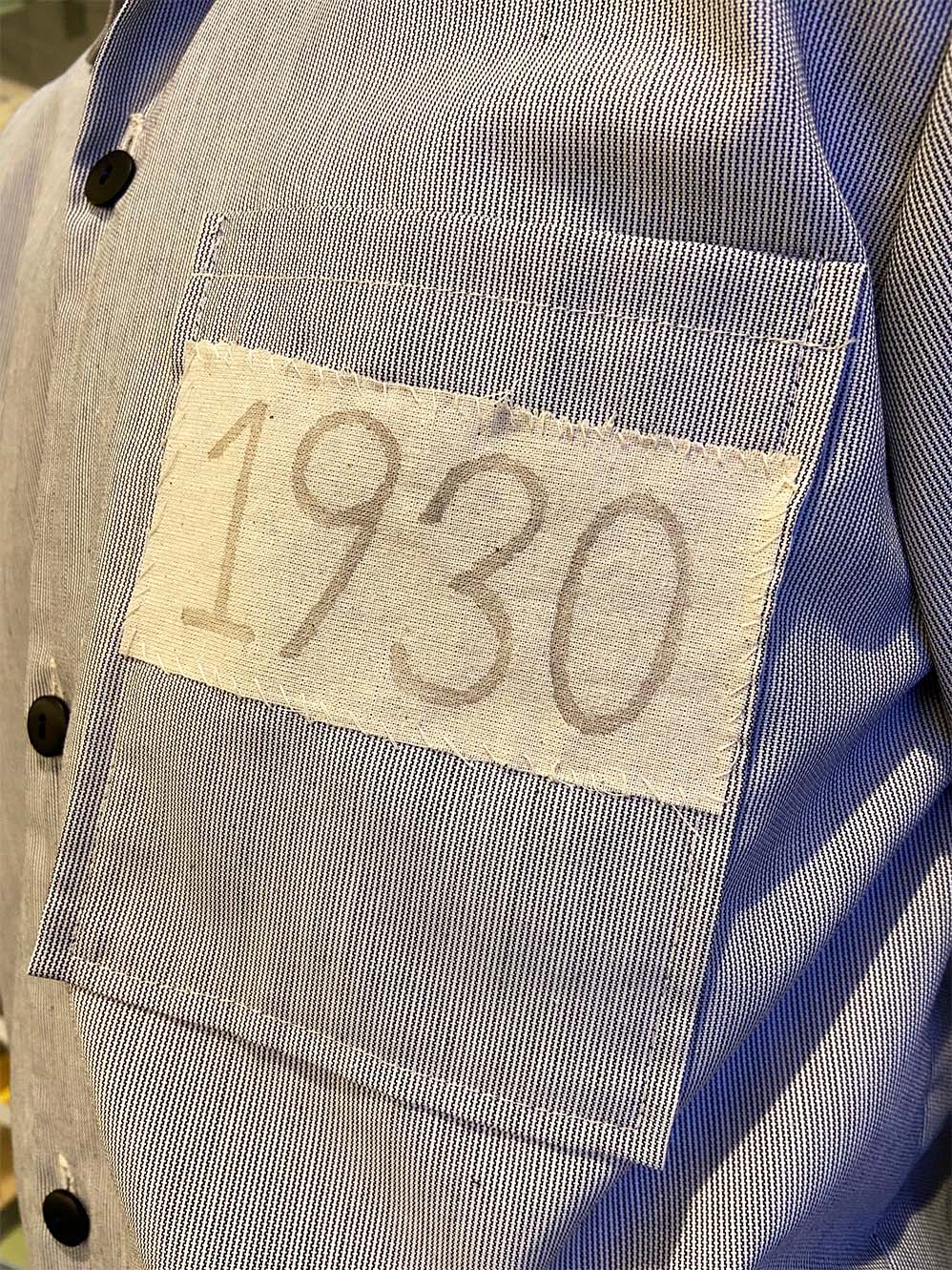 Close up of breast pocket on 1930s replica prison uniform 