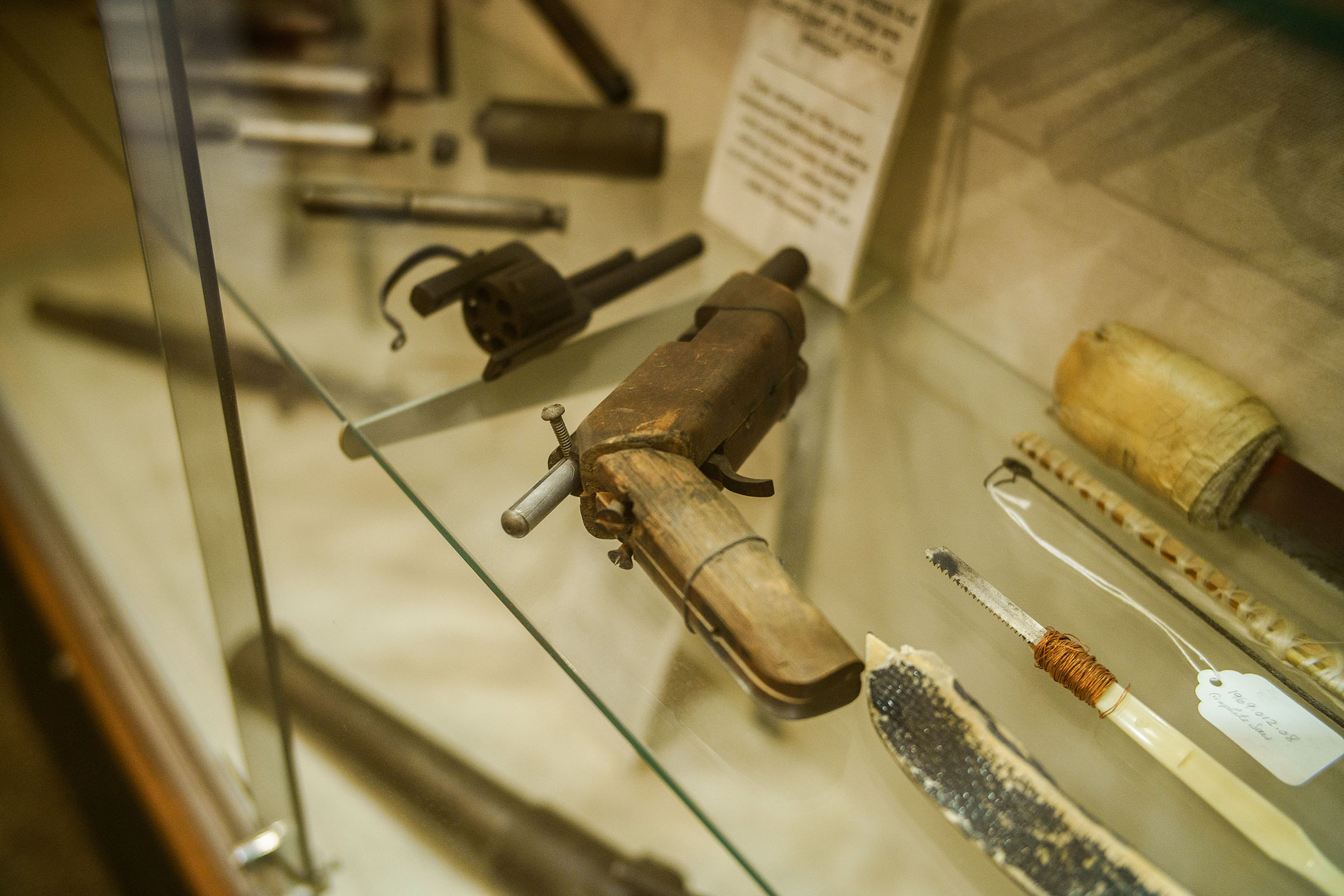 Close up of shoe making tools in a glass case 
