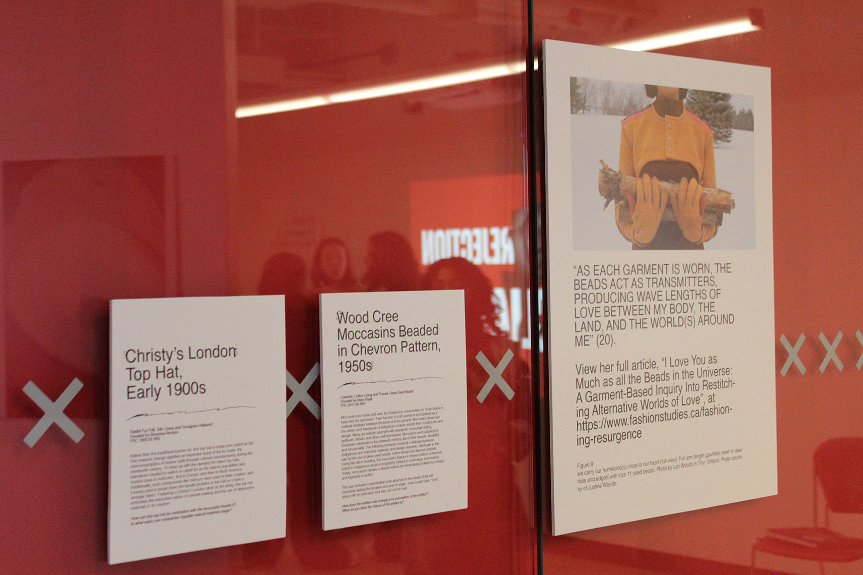 Three exhibition plaques that speak to the Christy London Top Hat and Wood Cree Moccasins 