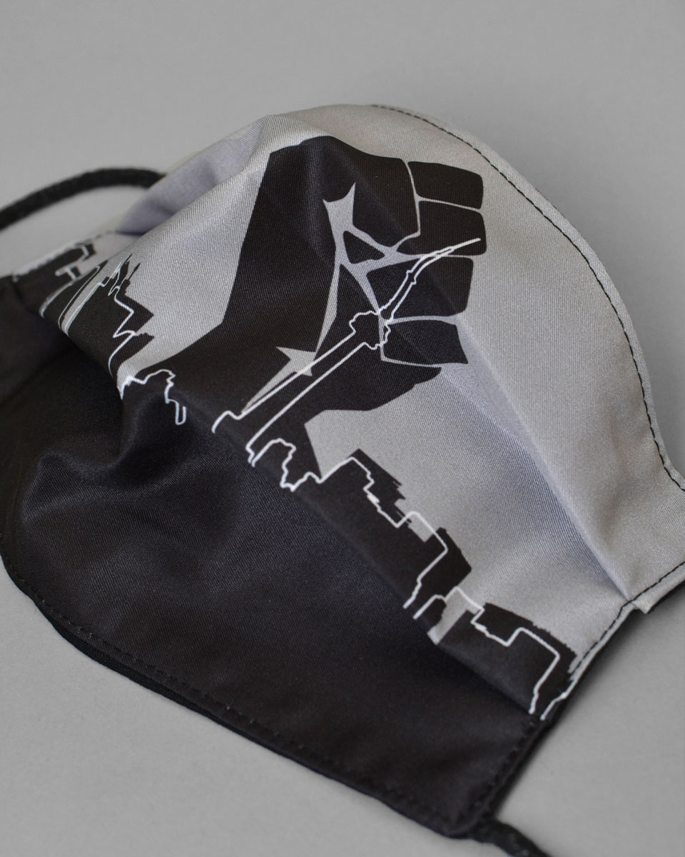 The mask laying flat to show the artwork 