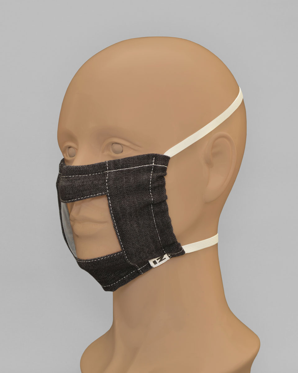 Side view of the lip reader mask with white head straps