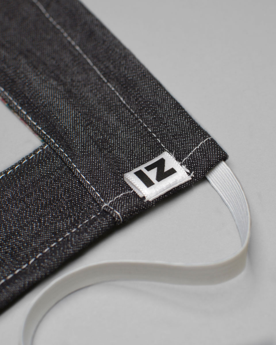 The IZ logo on the front of the lip reader mask