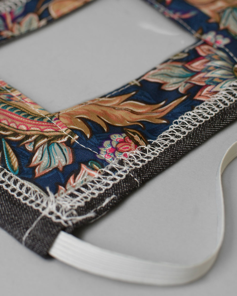 The colourful floral patterned lining of the face mask