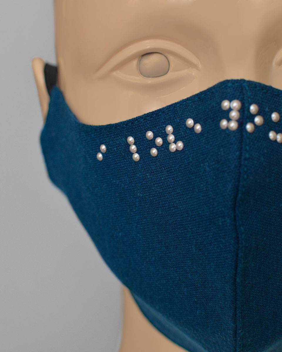 Close up of the pearls on the Braille face mask